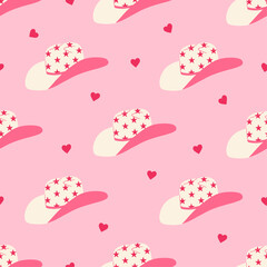 Cowgirl hat and heart seamless pattern. Wild west, western trendy design. Hand drawn pink vector illustration