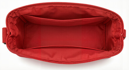 Empty first aid kit in bright red color with compartments on white background, storage for medical supplies, copy space
