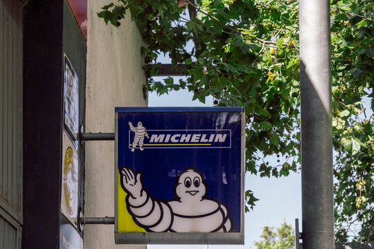 Barcelona, Spain-August 9, 2025. Michelin Sign with Bibendum Character on Building