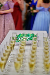 Graduation ceremony - ribbons, glasses and champagne