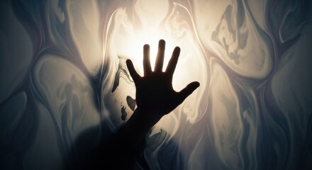 A persons hand reaching through a blurred ethereal light, symbolizing constraint and the human condition. Concept of liberation and effort to break free.