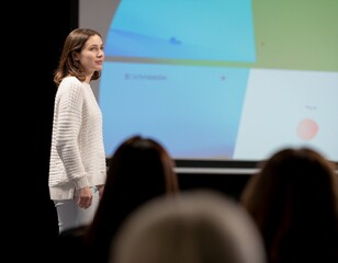 Confident Woman Speaking at Business Conference Presentation