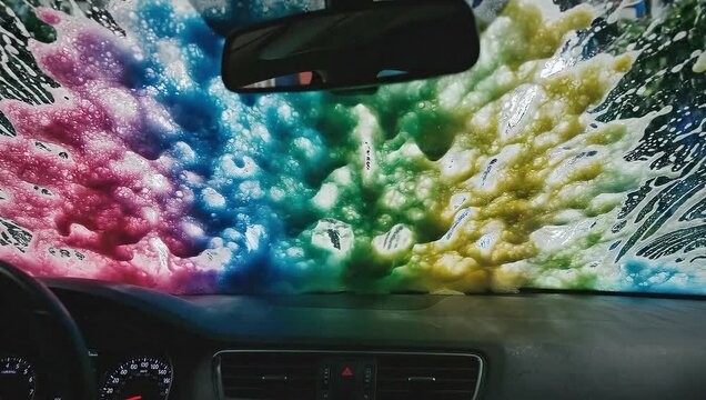 Colorful Car Wash: A vibrant kaleidoscope of soapy colors streams across the windshield, transforming a mundane task into a visually stunning spectacle of automotive care.
