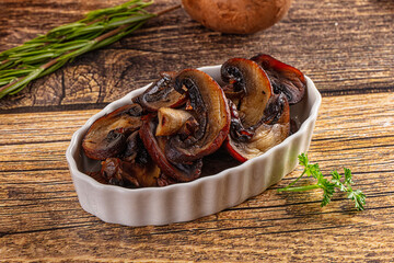 Fried champignon slices in the plate