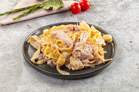 Italian pasta fettuccine with prosciutto