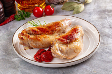 Roasted rabbit leg served rosemary