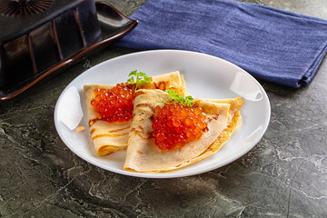 Russain traditional pancakes with red caviar
