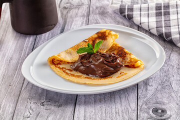 Sweet pancake with chocolate paste
