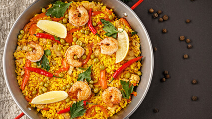 Delicious shrimp paella served in a large metal pan