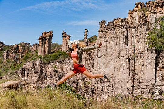 Woman jumping at Los Estoraques National Natural Park