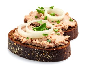 Delicious liver pate on rye bread with onion rings and fresh green herbs, a gourmet delight