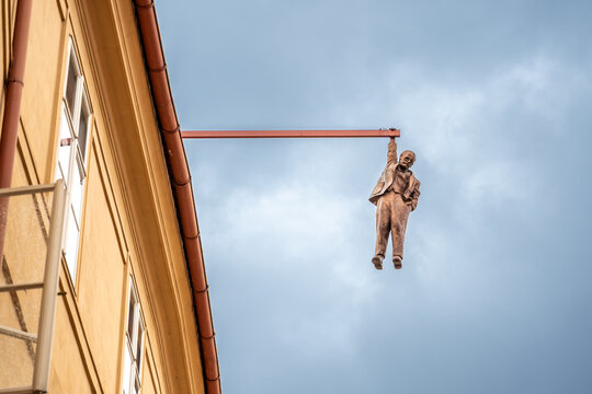 Prague, Czech Republic, August 9, 2023. The Hanging Man is a statue by sculptor David Čern&yacute;. It depicts Sigmund Freud hanging from a beam above Husova Street in the Old Town district.