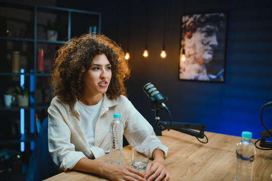 Content creator recording podcast in modern studio - Powered by Adobe