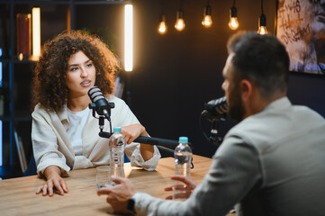 Content creators recording podcast in modern studio