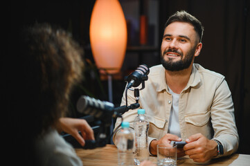 Content creators recording podcast in modern studio