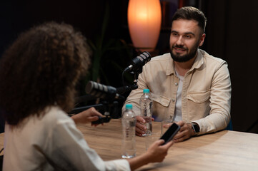 Content creators recording podcast in professional studio