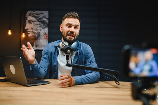 Content creator recording podcast in home studio - Powered by Adobe