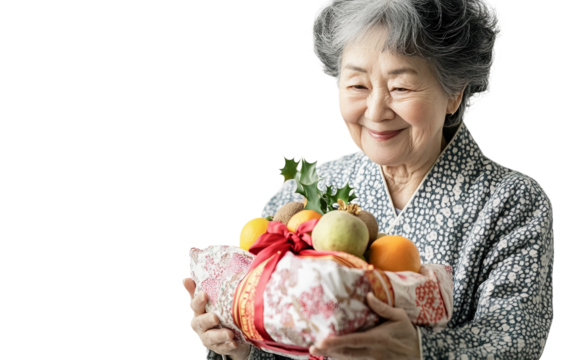 Elderly Korean woman presenting fruit in colorful bojagi wrapping as part of cultural tradition isolated on transparent background PNG