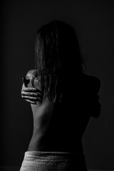 girl naked in a towel, back view