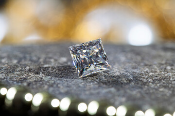 A diamond is sitting on a stone surface