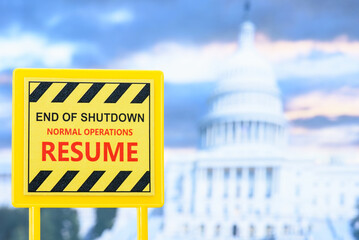 A sign announcing the reopening of the U.S. federal government after a shutdown, with the Capitol...