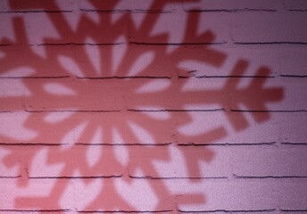 Background artistic with shadow of big snowflake decor and festive background	