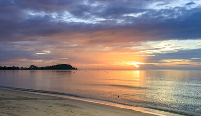 The sky is a beautiful mix of orange