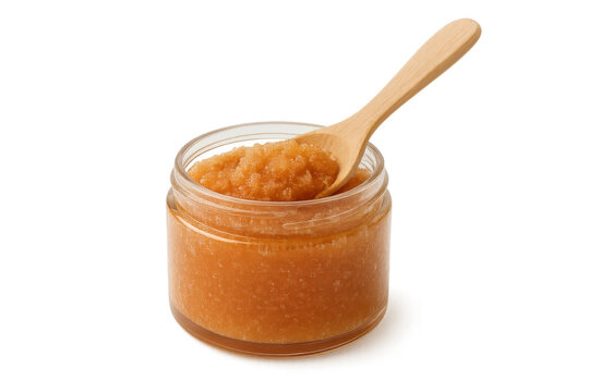 Body scrub with exfoliating texture in clear jar, wooden spoon, natural product for skincare beauty, transparent background