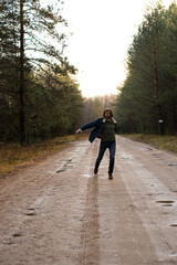 Man Dancing and Having Fun on Dirt Road Through Forest
