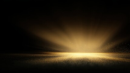Soft radiant golden light spreading like a sunrise across smooth matte black surface, subtle particles shimmering in the air, luxury luminous