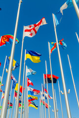 Georgian and Ukrainian flags waving together with the many international flags like DR Congo, Bosnia, Eritrea, Panama, Argentina, Angola, in Doha, Qatar.