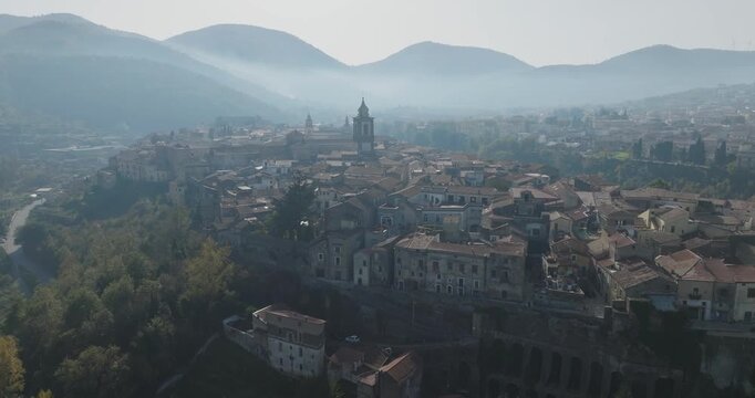Aerial view of Sant Agata de Goti revealing terracotta rooftops and historic buildings nestled amidst rolling hills, Sant Agata de Goti, Campania, Italy.