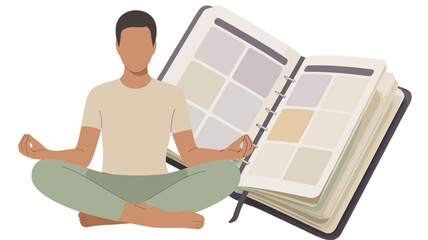 A man meditating in front of a journal.