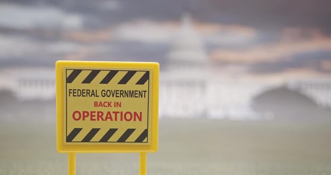 A sign announcing the reopening of the U.S. federal government after a shutdown, with the Capitol building in the background. Concept for public administration, political events, economic updates, etc