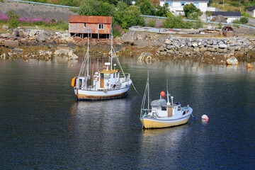 Moskenes harbor with fishing boats and the fisherman's home. Lofoten