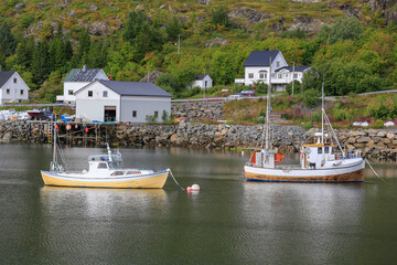 Moskenes harbor with fishing boats and the fisherman's home. Lofoten