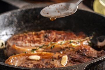 Beef steaks are pan-seared and topped with their own juices and sauce.