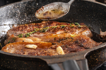 Fototapeta premium Beef steaks are pan-seared and topped with their own juices and sauce.