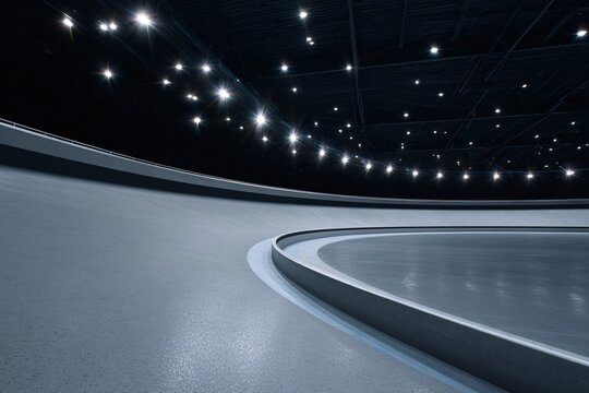 Ice skating rink featuring bright overhead lights in a modern facility