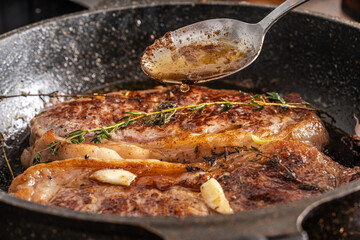 Beef steaks are pan-seared and topped with their own juices and sauce.