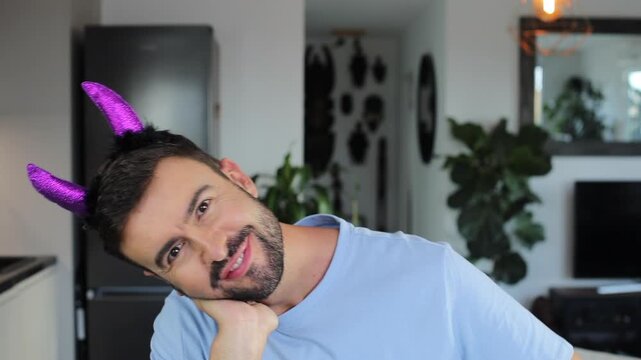 Funny man wearing demonic horns