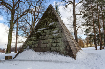 Winter landscape with a stone pyramid