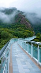 Scenic glass bridge winding through misty forested mountains