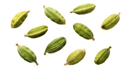 Scattered green cardamom pods aromatic spice for culinary use isolated on white background