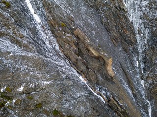 Rugged Snow-Covered Rock Cliff in Winter Terrain in British Columbia, Canada