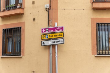 Exploring Segovia, Spain, with directional signs pointing to important locations and sights.