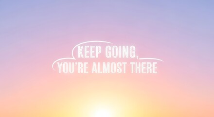 Keep going youre almost there motivational quote on a pastel colored sky background, inspiring message for overcoming challenges and achieving goals