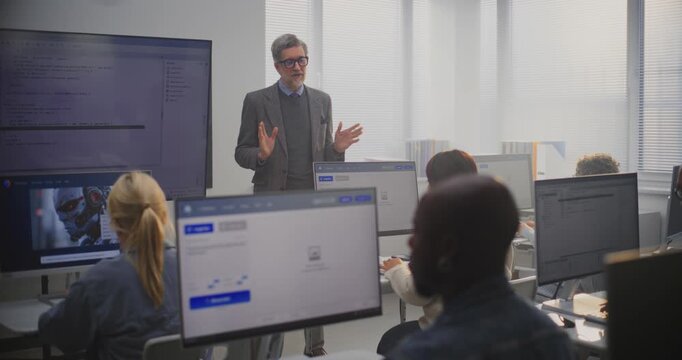 Stylish Male Instructor Stands by Monitor Showing Program, Explaining AI Generation Principles to Adult Students. Concept of Digital Education, Lifelong Learning, and Professional Development in Tech.