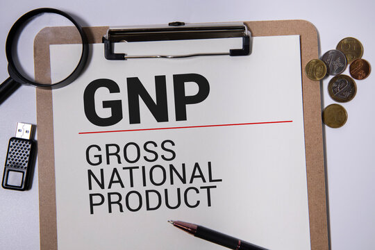 Hand holding wood cube block with 'GNI' text. GNI - short for Gross National Product