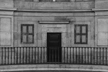 Symmetrical Facade with Door and Balcony in Black and White